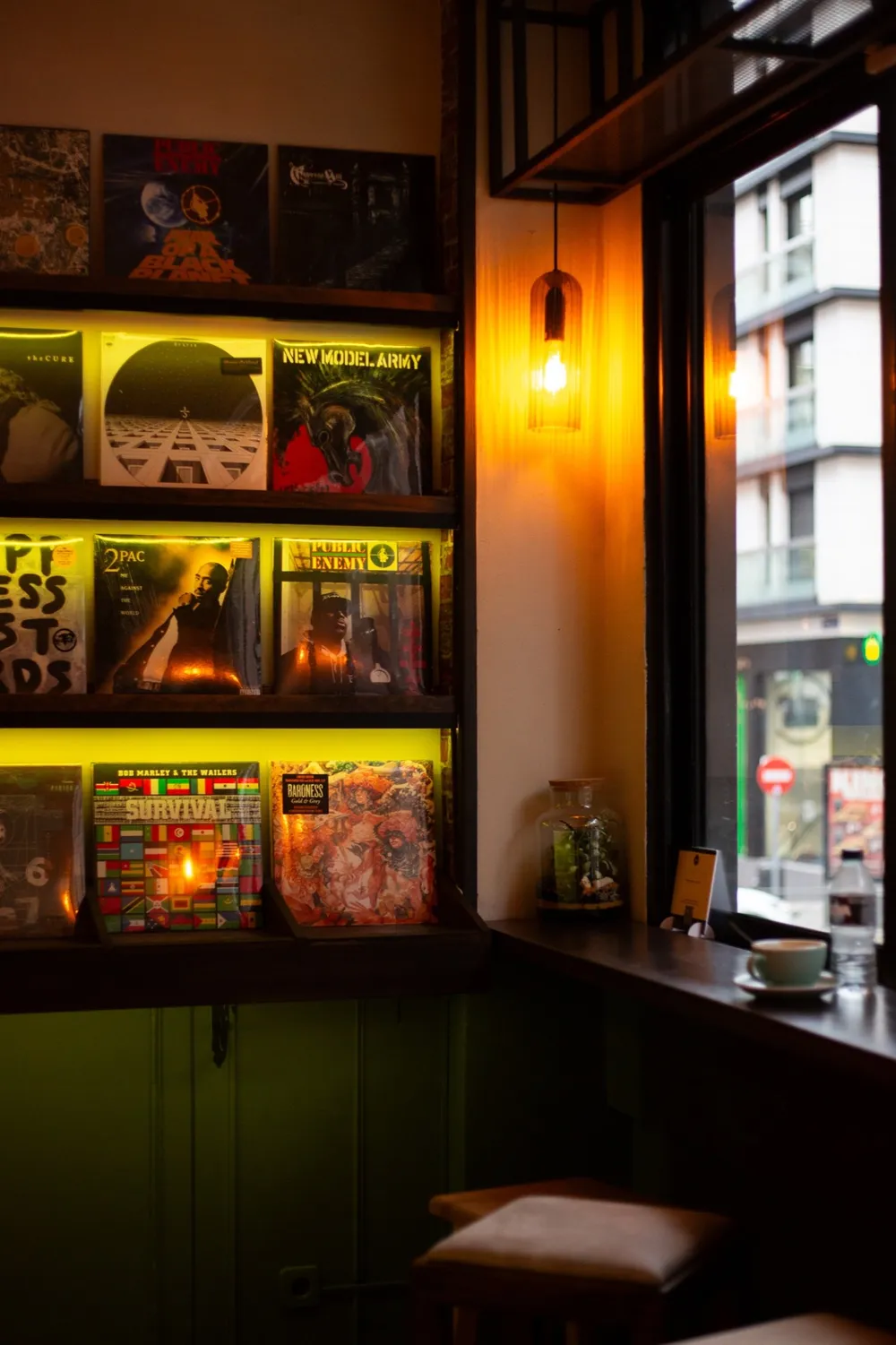 Vinyl records and window seating inside Licensed Coffee in Madrid